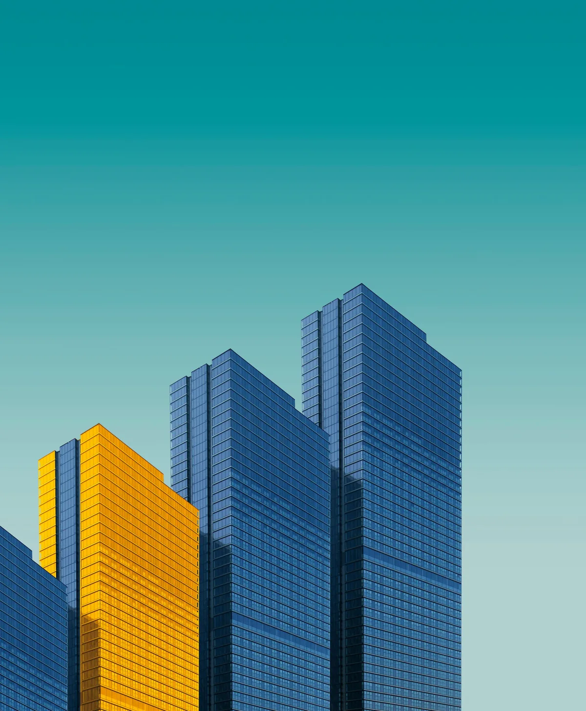 Modern high-rise towers in blue glass and amber — new architecture rising